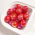 Macro view of 14mm vibrant red aurora acrylic beads for DIY jewelry making - Red