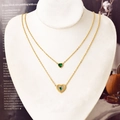 Double layer gold necklace set featuring green heart emerald pendants and small zircons - Necklace