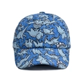 Detail of blue kids baseball cap featuring cartoon dinosaur patterns and waterproof fabric - Blue Dinosaur