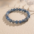 Detail of blue kyanite beaded bracelet with natural textures on a beige background - 8mm Round Bead (Exquisite Gift Box)