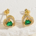Macro detail of 14K gold plated heart earrings with green zircon and pavé crystals - Green Zirconia