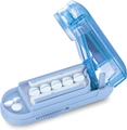 Detail of blue pill cutter showing stainless steel blade and multi-slot compartments - Blue