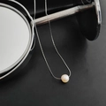 Minimalist titanium steel necklace featuring a single round natural pearl on a silver chain - White Small Pearl Silver Tone Necklace
