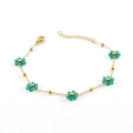 Golden stainless steel chain bracelet featuring green crystal flower charms and beads - Green Bracelet