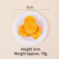 Realistic 9cm fake food model featuring orange sauce and nuts on a white ceramic plate - 9cm / Banana - No Keychain