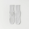 Light gray non-slip yoga crew socks with silicone grip dots and ribbed cuffs - One Size / Light Gray