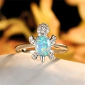 Eleganter Schildkrötenring aus Silber mit blau-grünem Opal und weißen Zirkonia-Steinen - US 8 / Weißer Opal