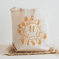 Cream canvas tote bag with Spooky Vibes pumpkin print for Halloween festivities - Spooky Vibes Ginger Melting Smiley