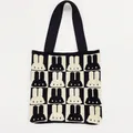 Close-up detail of knitted tote bag featuring black and white rabbit silhouette pattern - Apricot/Black
