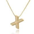 Macro shot of gold letter X pendant with micro-pave cubic zirconia on box chain - Letter X