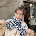 Winter faux fur scarf with black and white zebra pattern shown in a stylish cross wrap - Plush Zebra Pattern