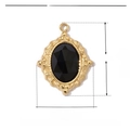 Detail view of 19mm gold stainless steel floral pendant with oval black natural stone - VG016
