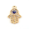 Hamsa Hand pendant with blue Evil Eye and sparkling rhinestones on white background - 10pcs Gold Base Evil Eye Hamsa Hand Pendants