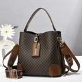 Brown vintage bucket bag with rhombic pattern and floral jacquard strap in 45-degree view - Great Wall Pattern Coffee