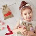 Detailed view of linen drawstring gift bags with heart prints and festive motifs - 10*14cm / Car Style