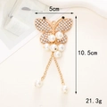 Elegante ciondolo a farfalla dorato con perle e strass, dimensioni 10,5x5cm peso 21,3g - D465 Farfalla con occhi neri