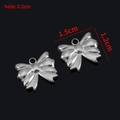 Ciondolo a fiocco argentato per gioielli fai-da-te, dimensioni 1,5 cm x 1,2 cm - Stile B / Color Acciaio