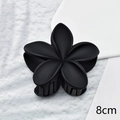 Detail showing an 8cm matte black flower hair claw clip with elegant 5-petal design - Black Matte 8cm