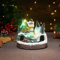 Detailed view of LED musical Christmas resin ornament with a rotating small train - Snowman