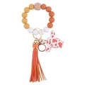 Silicone bead wristlet keychain with orange tassel and white spotted bunny charm - Turmeric