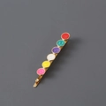 Golden metal hair clip featuring six colorful round enamel heart decorations in a studio view - Multicolor Enamel / Gold Round