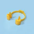 Bright yellow thumbs-up phone stand for portable tablet support on blue background - Bulk/Loose Packaging / Yellow