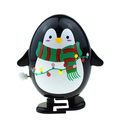 Wind-up penguin toy with red and green striped scarf and festive lights pattern - Oval Black Penguin with Green Scarf