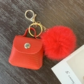 Red faux leather mini bag keychain with matching plush pompom and gold metal ring - Red