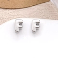 Minimalist silver letter F stud earrings with a polished metallic finish on a tray - Silver Letter F