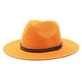 Detail of orange straw sun hat featuring a black leather studded band and gold buckle - Orange