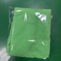 Green microfiber hair towel wrap folded in clear packaging on a green background - 60*25cm 70g / Fruit Green