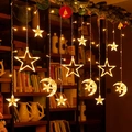 Warm yellow LED curtain lights with stars and moons hanging in a cozy indoor setting - Warm White Star Hugging Moon / Plug-in 220V