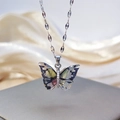 Silver chain necklace featuring a colorful butterfly pendant with black and yellow ink art - Chain Necklace Transparent Colorful Silver
