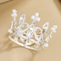 Macro detail of silver alloy mini crown featuring white pearls and heart hollow patterns - Mini Silver 01