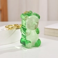 Close-up of green translucent jelly bear keychain with gold metal ring for bags - Light Gold Chain + Bear / Green