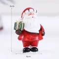 Nordic resin Santa Claus figurine with green gift box and classic red suit, 6cm height - Gift Box Santa Claus