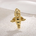 Macro detail of a gold-plated Cupid angel pendant with heart and intricate wing details - Angel 2