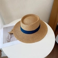 Top view of a woven straw flat top hat with a dark blue decorative ribbon on a white table - M (56-58cm) / Khaki Fedora-Navy Ribbon