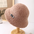Detail of light brown lamb wool bucket hat featuring cozy texture and button logo patch - Khaki