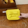 Mini yellow crossbody bag for girls with bow decoration and gold chain strap - Yellow