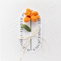 Detailed view of handmade knitted orange rose gift with green leaf and ribbon - Blooming Tulip - Orange