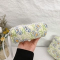 Quilted beige cosmetic bag with blue and orange floral patterns and white ribbon zipper - Green Ribbon Small (19x7x6)