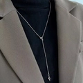 Detail of silver OT buckle Y-shaped knot necklace worn over a black turtleneck sweater - Silver Snake Chain Double Knot