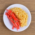 Realistic PVC miniature meal model with golden rice and red ginger on white plate - Shredded Carrot Rice Bowl