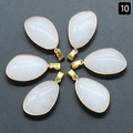 Set of six teardrop white crystal pendants with gold plated edges on grey background - White Jade (Single)