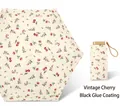 Beige folding umbrella with vintage red cherry pattern and golden handle with black coating - Black Pole Black Glue Retro Cherry Shading