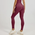 Women's high waist yoga leggings in burgundy with side mesh pockets and peach lift design - S / Berry Red