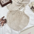 Detail of cream woven mesh tote bag with intricate hollow patterns on soft fabric - Large