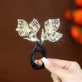 Bigoudi papillon doré avec des strass étincelants et une bande élastique noire - Style Feuille D'arbre Or