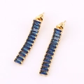 Golden linear drop earrings with dark blue rectangular crystals in a minimalist design - Sapphire Blue